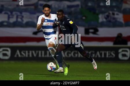 Queens Park Rangers' Macauley Bonne (left) and Swansea City's Marc Guehi battle for the ball during the Sky Bet Championship match at the Kiyan Prince Foundation Stadium, London. Stock Photo