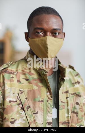 Portrait of African american military man in protective mask looking at camera Stock Photo