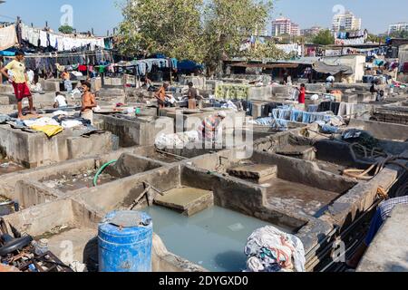 Mumbai India Clothes hanging and washers, or Dhobis working at the Dhobi Ghat. Stock Photo