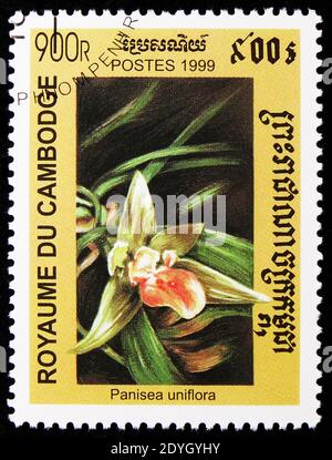 MOSCOW, RUSSIA - AUGUST 8, 2019: Postage stamp printed in Cambodia shows Panisea uniflora, Native orchids serie, circa 1999 Stock Photo