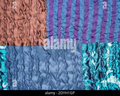 textile background - hand-crafted detail of blue patchwork fabric Stock Photo