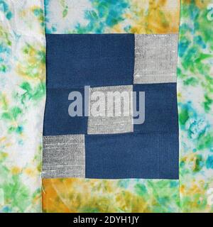 textile background - stitched detail of patchwork fabric with floral pattern Stock Photo