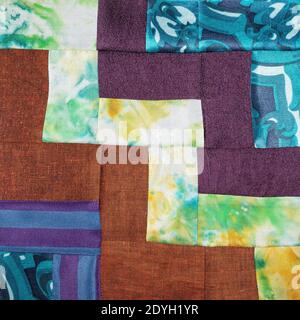textile background - stitched detail of patchwork cloth from various fabrics Stock Photo