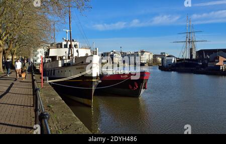 Bristol, UK, Hotwell's Road, Cannon's Marsh area of floating harbour with Balmoral and Ellan shops moored looking toward city centre Stock Photo