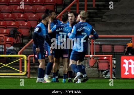 Garath McCleary of Wycombe Wanderers (L) celebrates with teammates after scoring his sides first goal against Bristol City EFL Skybet championship match, Bristol city v Wycombe Wanderers at Ashton Gate Stadium in Bristol, Avon on Boxing Day, Saturday 26th December 2020. this image may only be used for Editorial purposes. Editorial use only, license required for commercial use. No use in betting, games or a single club/league/player publications. pic by Lewis Mitchell/Andrew Orchard sports photography/Alamy Live news Stock Photo