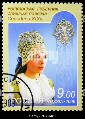 MOSCOW, RUSSIA - AUGUST 10, 2019: Postage stamp printed in Russia shows Moscow region, Girl armband, Headdresses serie, circa 2009 Stock Photo