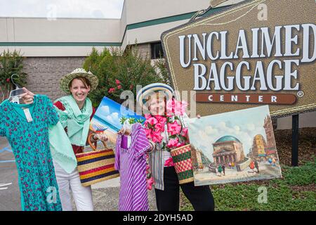 Alabama Scottsboro Unclaimed Baggage Center centre lost airline luggage,shopping shoppers bargain hunting,women friends clothing front entrance sign Stock Photo