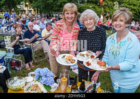 Huntsville Alabama,Burritt on the Mountain,City Lights & Stars Concert Series,picnic lawn grass friends family dining eating women senior woman, Stock Photo