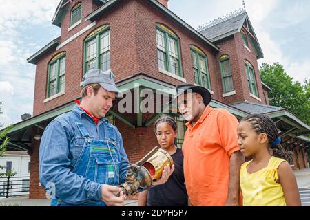 Alabama Tuscumbia Railroad Depot historic train station engineer guide,family Black grandfather man girls sisters,outside exterior, Stock Photo