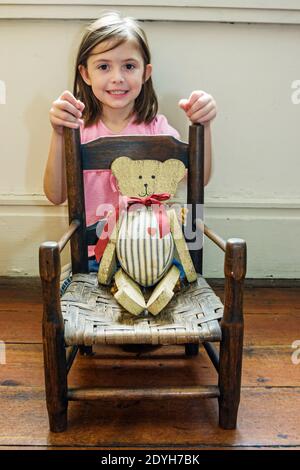 Alabama Greensboro Magnolia Grove House Museum,Greek Revival temple style home 1840,child's chair toy teddy bear girl visitor, Stock Photo