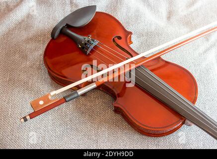 Violin on the bed with fabric background Stock Photo