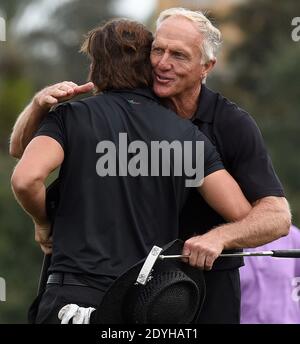 December 20, 2020 - Orlando, Florida, United States - Australian Greg Norman (r) and his son, Greg Norman Jr. embrace after completing the final round at the PNC Championship golf tournament at the Ritz-Carlton Golf Club on December 20, 2020 in Orlando, Florida. On Christmas Day, Norman posted a photo to Instagram from a hospital bed where he was being treated for COVID-19 symptoms. NormanÕs son also posted a photo to Instagram, stating that he and his fiancee have tested positive for the COVID-19 virus. (Paul Hennessy/Alamy) Stock Photo
