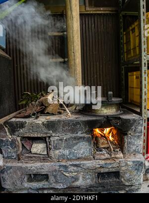 Traditional Japanes Rice Cooking over open Fire by Atsuko Kato Stock Photo