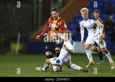 Birkenhead, UK. 26th Dec, 2020. Billy Clarke of Bradford City (l) is tackled by Jay Spearing of Tranmere Rovers. EFL Skybet Football league two match, Tranmere Rovers v Bradford City at Prenton Park, Birkenhead, Wirral on Boxing Day, Saturday 26th December 2020. this image may only be used for Editorial purposes. Editorial use only, license required for commercial use. No use in betting, games or a single club/league/player publications.pic by Chris Stading/Andrew Orchard sports photography/Alamy Live News Credit: Andrew Orchard sports photography/Alamy Live News Stock Photo