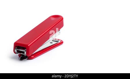 Red stapler on a white background. High quality photo Stock Photo