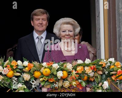 New Dutch King Willem-Alexander, Royal Highness Princess Beatrix and Queen Maxima wave from the balcony of the Royal Palace at the Dam Square in Amsterdam, The Netherlands on April 30, 2013. Photo by Alain Gil-Gonzalez/ABACAPRESS.COM Stock Photo
