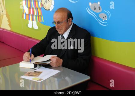 Clive Davis visited Sturges' Park Ridge yogurt franchise Menchie's in Chicago, IL, USA on Saturday, May 4, 2013. The music legend, who guided the careers of Aretha Franlin, Alicia Keys, Whitney Houston and Janis Joplin stopped by and signed copies of his new biography, 'The Soundtrack of My Life.' Menchie's also hosted a drawing in which two winners were picked to have a one-on-one meet and greet with Davis. While 23-year-old singer/songwriter Kim Schaefer performed for Davis, attorney and aspiring musician Brian P. Kerwin used his time to talk with Davis. Photo by Cindy Barrymore/ABACAPRESS.C Stock Photo