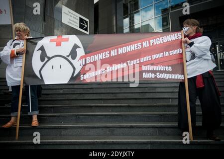 Around 150 French nurses and nurse aids joined by students took the street for a demonstration called by Facebook collective 'Ni Bonnes, ni Nonnes, ni Pigeonnes ('Neither Maid, Nor Nuns, Nor Pigeons') to ask for reconsideration of their working conditions and raise awarness of the patients' risks due to lack of staff and means, in Paris, France on May 12, 2013. Photo by Nicolas Messyasz/ABACAPRESS.COM Stock Photo