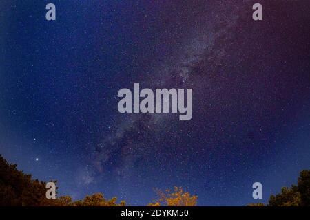 Starry sky with part of Milky Way visible on a very clear night Stock Photo
