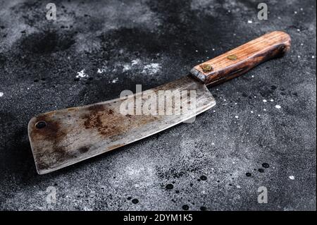 Vintage butcher cleaver with wooden handle. Black background. Top view Stock Photo