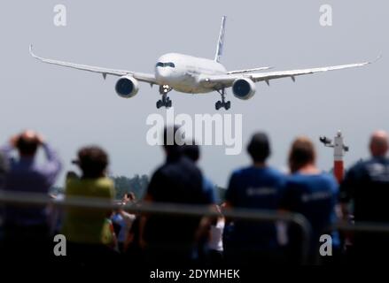 The new Airbus A350 XWB lands after its long-awaited inaugural flight at Toulouse-Blagnac airport, southwestern France on June 14, 2013. The A350 XWB is the first in a family of super-efficient passenger planes Airbus designed to go head-to-head with rival Boeing's 787 Dreamliner and 777s. The highly fuel-efficient plane, made with a majority of composite materials, likely means an appearance at the upcoming Paris Air Show which begins next Monday at Le Bourget airport. Photo by Patrick Bernard/ABACAPRESS.COM Stock Photo