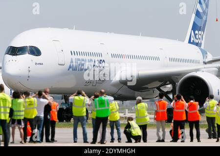 The new Airbus A350 XWB lands after its long-awaited inaugural flight at Toulouse-Blagnac airport, southwestern France on June 14, 2013. The A350 XWB is the first in a family of super-efficient passenger planes Airbus designed to go head-to-head with rival Boeing's 787 Dreamliner and 777s. The highly fuel-efficient plane, made with a majority of composite materials, likely means an appearance at the upcoming Paris Air Show which begins next Monday at Le Bourget airport. Photo by Patrick Bernard/ABACAPRESS.COM Stock Photo