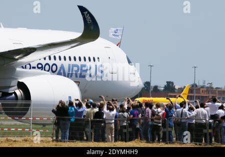 The new Airbus A350 XWB lands after its long-awaited inaugural flight at Toulouse-Blagnac airport, southwestern France on June 14, 2013. The A350 XWB is the first in a family of super-efficient passenger planes Airbus designed to go head-to-head with rival Boeing's 787 Dreamliner and 777s. The highly fuel-efficient plane, made with a majority of composite materials, likely means an appearance at the upcoming Paris Air Show which begins next Monday at Le Bourget airport. Photo by Patrick Bernard/ABACAPRESS.COM Stock Photo