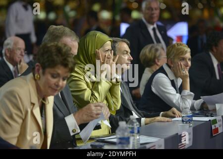 Maryam Rajavi, president of the National Council of Resistance of Iran (NCRI), and former Spanish PM Jose Luis Zapatero attend the annual meeting of the Iranian resistance in Villepinte, near Paris, France, on June 22, 2013. Some 500 parliamentarians from the United States, Canada, Europe, the Middle East and Arab countries joined the gathering one week after Hassan Rouhani, a moderate cleric, was declared winner of Iran's presidential election. Photo by Mousse/ABACAPRESS.COM Stock Photo