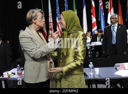 Maryam Rajavi, president of the National Council of Resistance of Iran (NCRI), speaks to former French Minister Michele Alliot-Marie at the annual meeting of the Iranian resistance in Villepinte, near Paris, France, on June 22, 2013. Some 500 parliamentarians from the United States, Canada, Europe, the Middle East and Arab countries joined the gathering one week after Hassan Rouhani, a moderate cleric, was declared winner of Iran's presidential election. Photo by Mousse/ABACAPRESS.COM Stock Photo