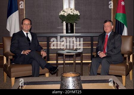 French President Francois Hollande (L) and King Abdullah II of Jordan meet during the French president's one-day official visit to Amman, Jordan, on June 23, 2013, for talks on the Syrian conflict as well as the issue of hundreds of thousands of refugees who have fled the to kingdom. French President Francois Hollande urged support for the Syrian opposition but said it should 'clarify' its ties with extremists, in talks with Jordan's King Abdullah II. Photo by Bertrand Langlois/Pool/ABACAPRESS.COM Stock Photo