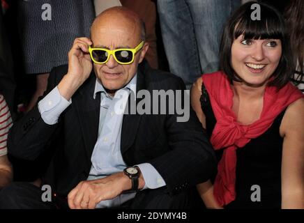 Bordeaux' mayor Alain Juppe tries on yellow sunglasses whilst attending a night event in Bordeaux, southwesten France, June 27, 2013. Photo by Patrick Bernard-Quentin Salinier/ABACAPRESS.COM Stock Photo