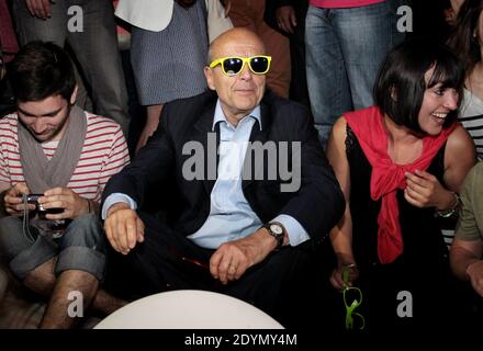 Bordeaux' mayor Alain Juppe tries on yellow sunglasses whilst attending a night event in Bordeaux, southwesten France, June 27, 2013. Photo by Patrick Bernard-Quentin Salinier/ABACAPRESS.COM Stock Photo