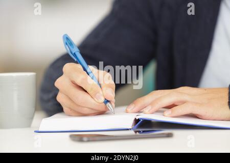 pen in man hand on white background Stock Photo