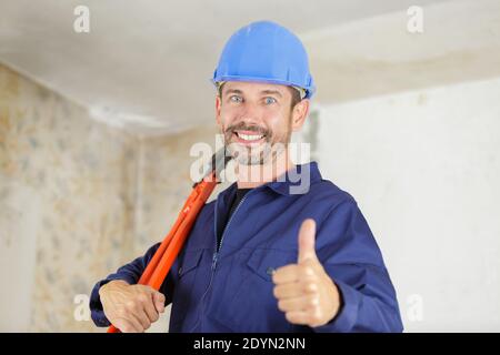 a worker uses scissors indoors Stock Photo