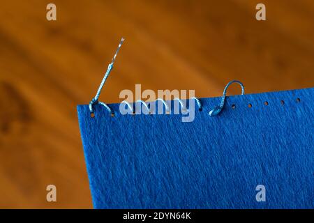 clothing industry,sewing with a needle Stock Photo