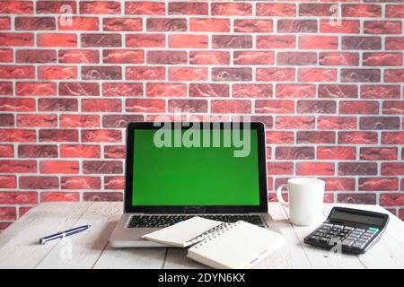 laptop with blank screen on office desk. Stock Photo