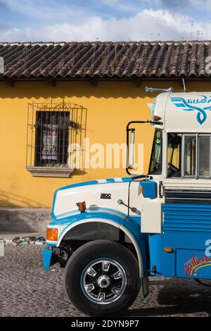 Antigua, Guatemala Colorfully painted 'chicken bus' at bus station Stock Photo