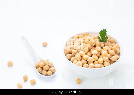 Chickpeas on  plate, isolated on  white background. Stock Photo