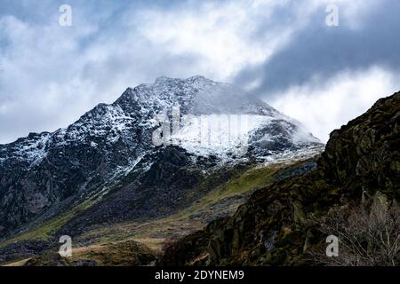 The mighty Tryfan mountain in Snowdonia National Park. This is a popular mountain to climb with amazing views of Llyn Ogwen lake. Stock Photo
