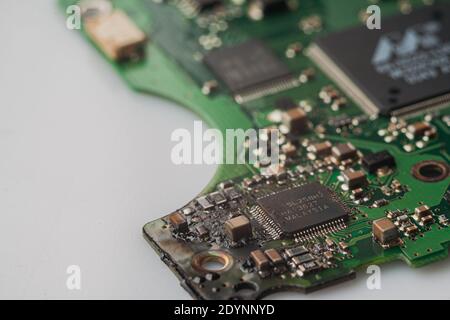 Microcircuit macro close up green color. Concept for technology, repair of computers, smartphones and electronics. Stock Photo