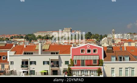 Apartment buildings and Ajuda national palace on the hills of Lisbon, Portugal Stock Photo