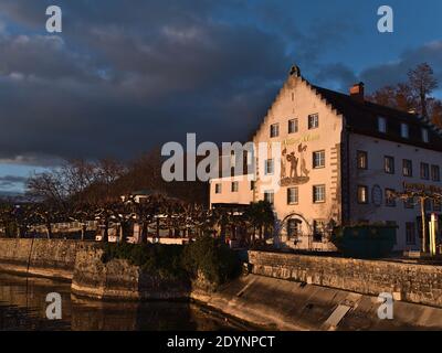 Bankrupt hotel Wilder Mann on the shore of Lake Constance located in a historic building constructed around 1630 in afternoon sun in winter season. Stock Photo