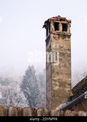 Old chimney made of stone and bricks built in the year 1900, in Sighisoara Romania. Stock Photo