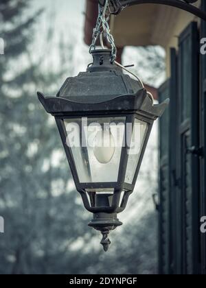 Old vintage lam post or street lamp with a light bulb in Sighisoara citadel Stock Photo