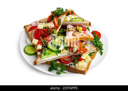 Bruschetta with different fillings on a white background. Vegetables, meat and cheese bruschetta. High quality photo Stock Photo