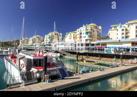 Boats Moored In The Albufeira Marina Modern Architecture Colourful Apartment Buildings Albufiera The Algarve Portugal Stock Photo