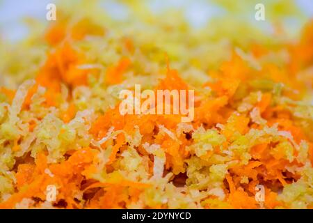 Macro shot of potatoes and other yellow and orange grated vegetables Stock Photo
