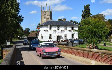 Classic  1959  Pink Vauxhall Cresta  PA  Car crossing historic packhorse bridge at Great Barford Bedfordshire England. Stock Photo
