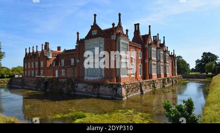 Helmingham Hall with moat bridges and reflections. Stock Photo