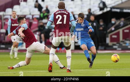 London, UK. 27th Dec, 2020. Brighton's Solly March shoots during the Premier League match between West Ham United and Brighton & Hove Albion at the London Stadium. Credit: James Boardman/Alamy Live News Stock Photo